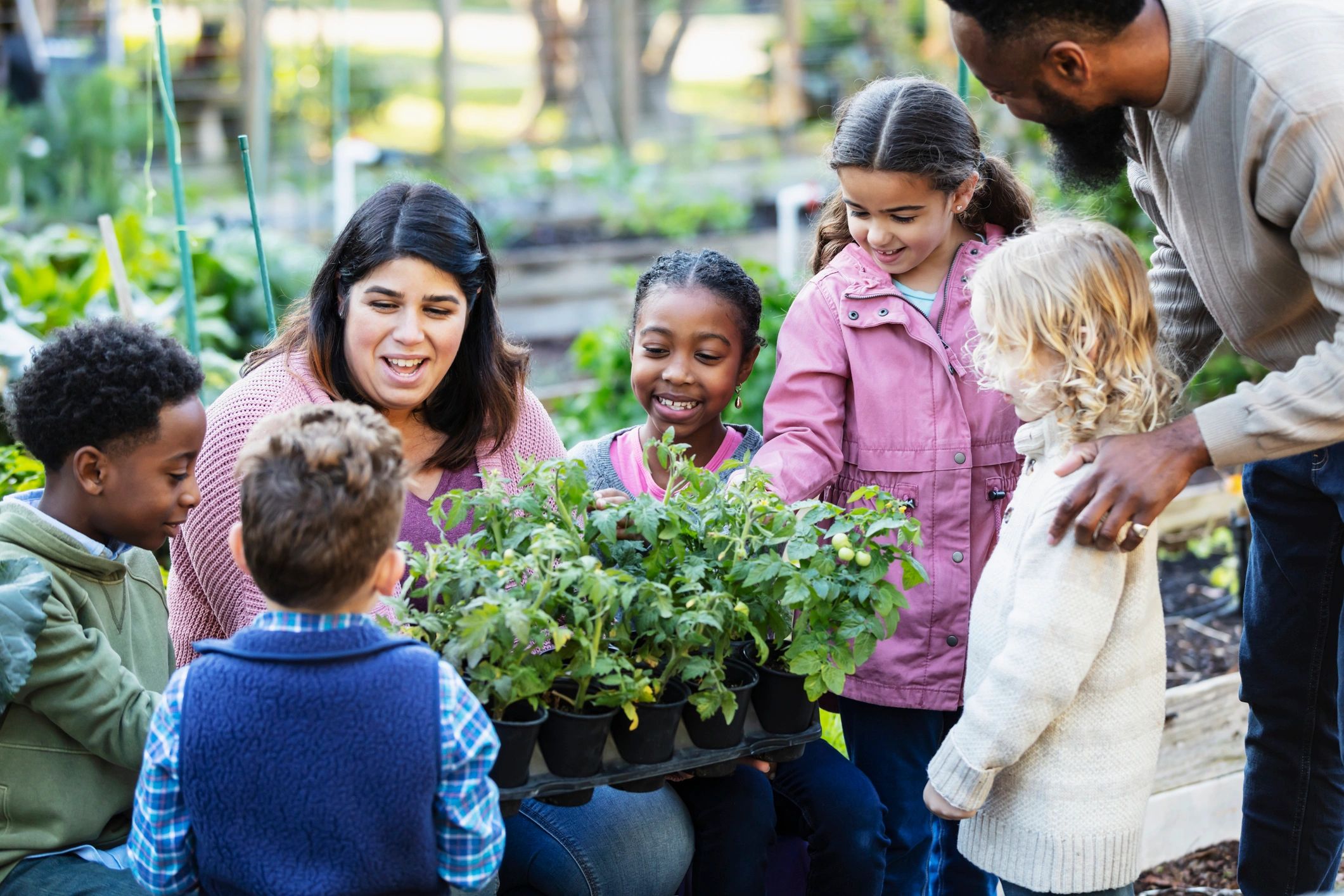 Garden learning session with adults and children