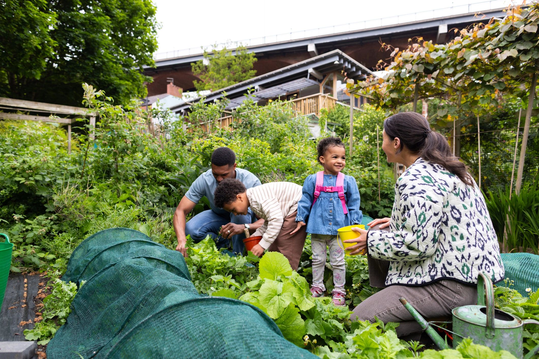 Community members gardening together outdoors